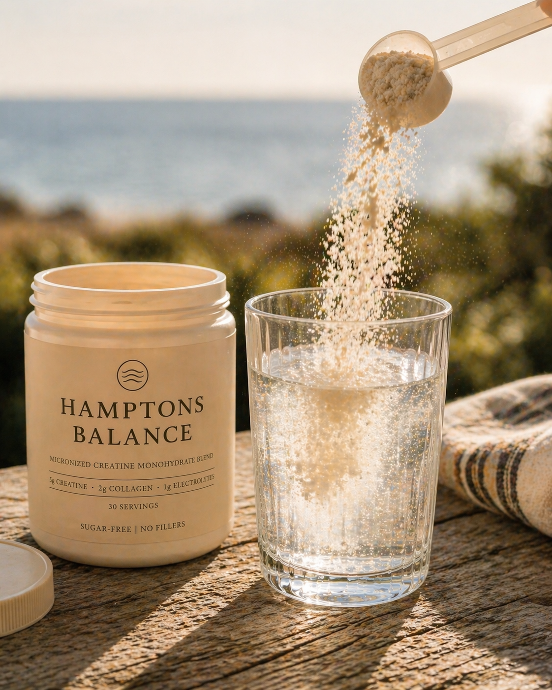 Hamptons Balance supplement being poured into a glass with a scenic background