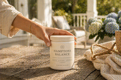 Women Hand reaching for Hamptons Balance creatine tub on Hamptons porch with hydrangeas for Daily Ritrual